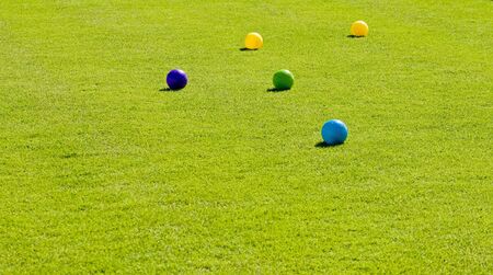 Boccie Balls on a green lawnの写真素材