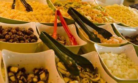 Pasta and vegetables at a pasta barの写真素材