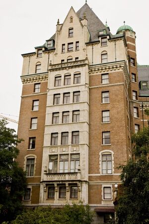An old brick and stone building with decorative spiresの写真素材