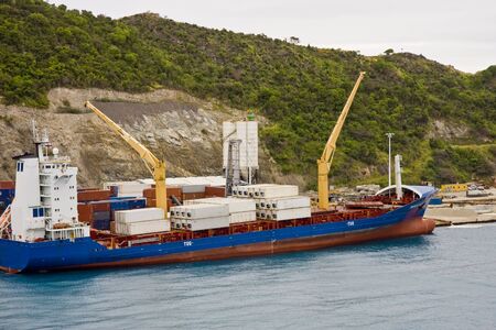 A large freighter on the coast getting loadedの写真素材