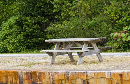 A public picnic table by an intracoastal waterwayの写真素材