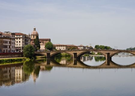 A bridge over the Arno River in Florence, Italy near the Ponte Vecchioの写真素材