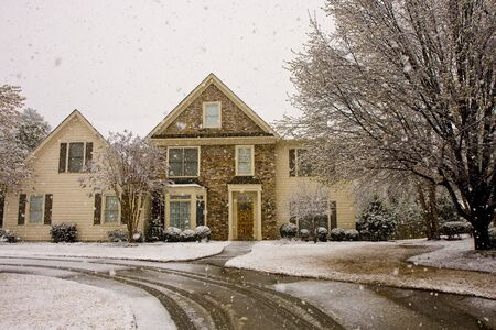 A nice house in a snow stormの写真素材