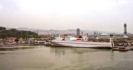 A Cruise Ship along a freight pier in Barcelonaの写真素材