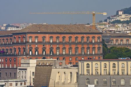 Colorful buildings overlooking the harbor in naples, italyの写真素材