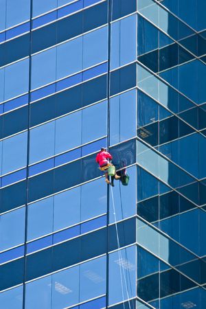 A window washer on a A nice tall office building の写真素材