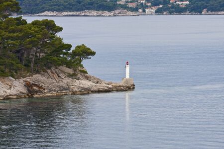 A warning beacon on a point of land off the coastの写真素材