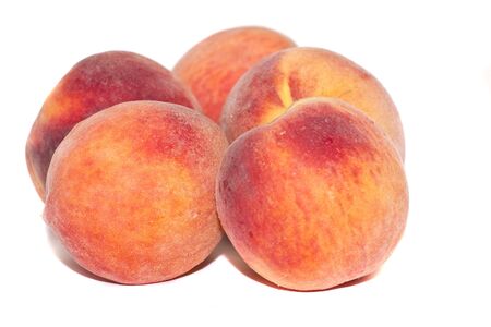 Fresh ripe juicy peaches   on a white backgroundの写真素材