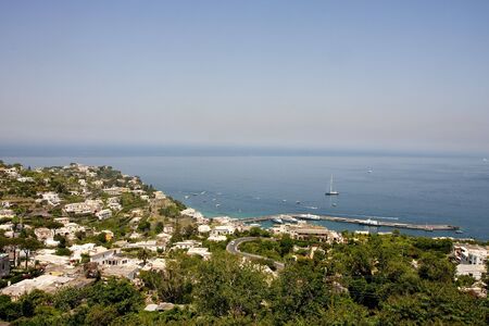 A view across the hilly seaside port at Capri in Italyの写真素材