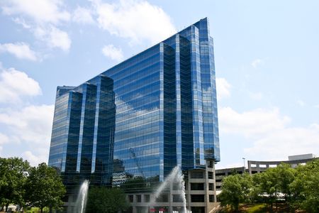 A modern office building rising into the skyの写真素材
