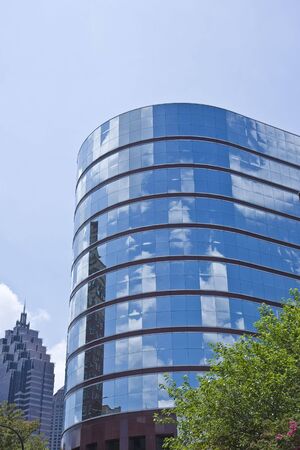 A modern office building rising into the skyの写真素材