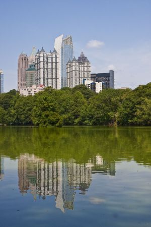 A view of the Atlanta Skyline shot from Piedmont Park with reflections in lakeの写真素材