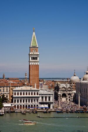 A view of the beautiful architecture, churches, and boats along the canals in Venice, Italyの写真素材
