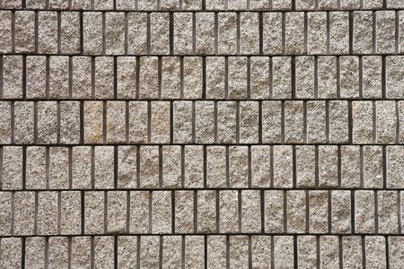 A cut block masonry wall for backgrounds or texturesの写真素材