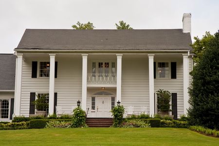 An old white colonial house with columnsの写真素材