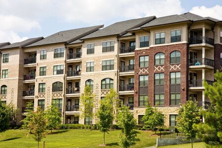 A large modern brick and stucco apartment complexの写真素材