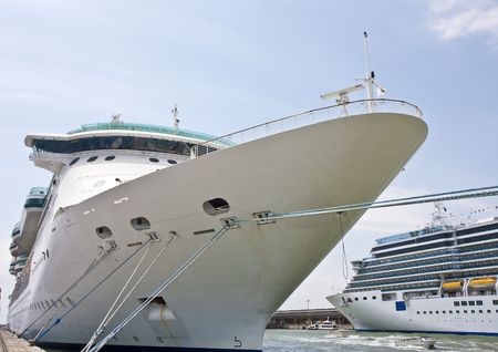 Two luxury cruise ships tied up at a pierの写真素材