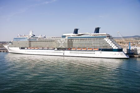 A luxury cruise ship anchored in an Italian portの写真素材