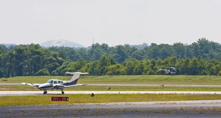 Planes on the tarmac at a small regional airportの写真素材