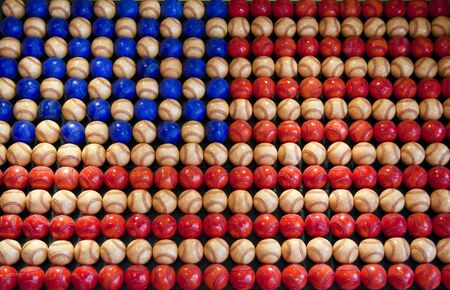 An American flag made of red, white, and blue baseballsの写真素材