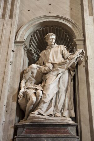 Statue in alcove of St Peters Basilica in the Vaticanの写真素材