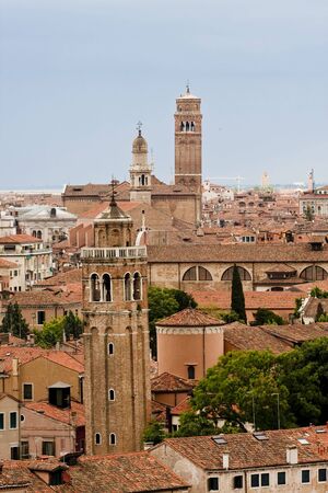 View of several bell towers across the rooftops of Venice Italyの写真素材
