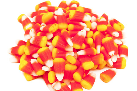 Orange and Yellow Candy Corn on a white background