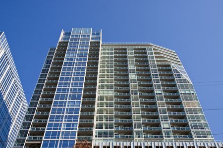 A new modern blue high rise condo buildingの写真素材