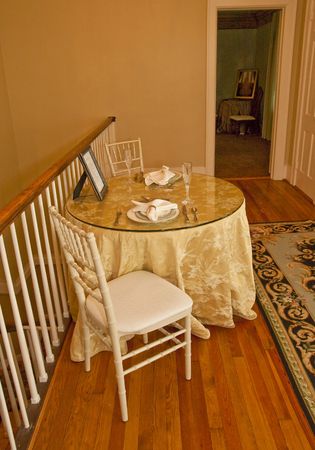 A formal table setting for two in an event planning venueの写真素材