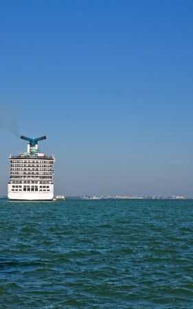 A modern luxury cruise ship on the horizon with room for copy spaceの写真素材