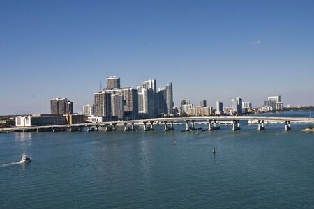 A bridge across Biscayne Bay with Miami in Backgroundの写真素材