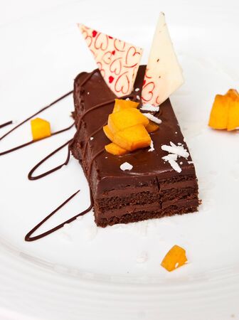 A custom decorated brownie on a white plateの写真素材