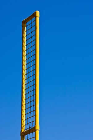 A foul line pole at a baseball field against blue skyの写真素材