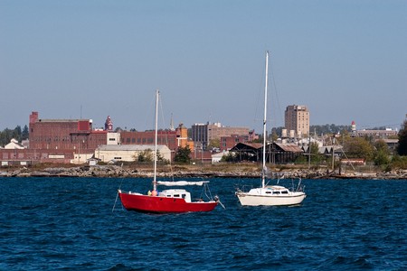 Two boats on blue water without sailsの写真素材