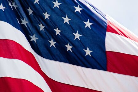 Closeup of an American flag blowing in the windの写真素材