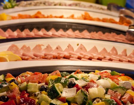 Fresh salads and antipasto on a salad barの写真素材