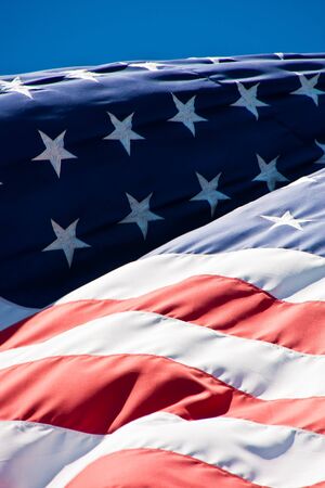An American flag blowing in the wind closeupの写真素材