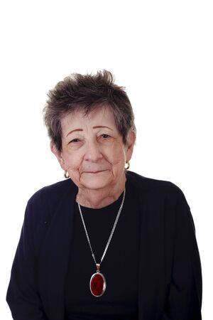 An old woman nicely dressed with a small smileの写真素材