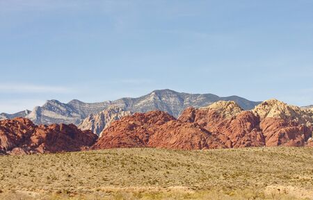 Rocky red hills on the edge of a desertの写真素材