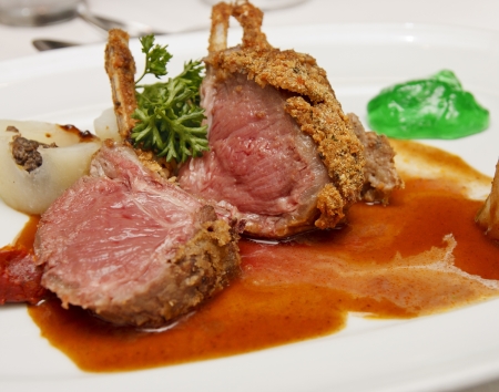 Lamb chops on a white plate with mint jellyの写真素材
