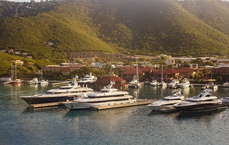 Harbor on St Thomas with many luxury yachts docked in early morningの写真素材