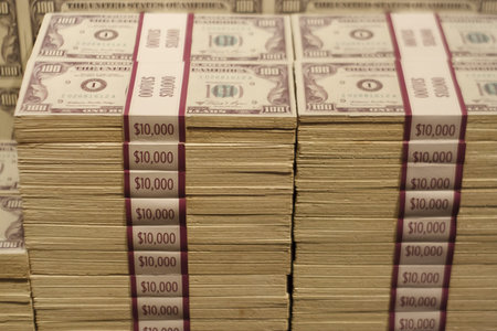 Stacks of Hundred Dollar Bills Banded in Ten Thousand Dollar Packets