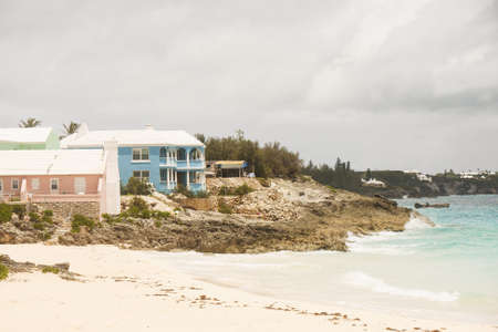 Pink and blue vacation homes on coast of Bermudaの写真素材
