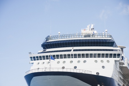 Bow of blue and white luxury cruise ship under blue skiesのeditorial素材