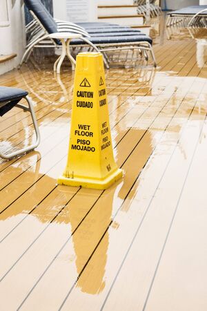 Warning Cone on wet wooden ships deckのeditorial素材