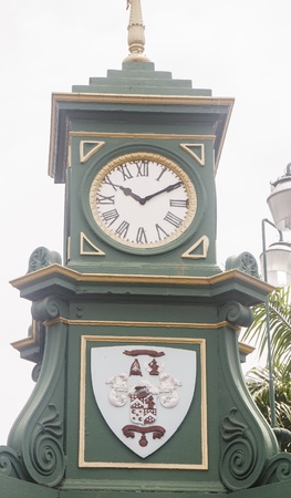 An old green clock in a town square on St. Kittsの写真素材