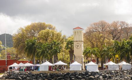 A flea market under white tents on a tropical islandのeditorial素材