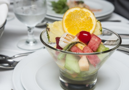 A fruit bowl on a dinner table for dessert or appetizerの写真素材