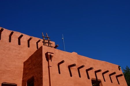 Navajo Pueblo architecture under a clear blue skyの写真素材