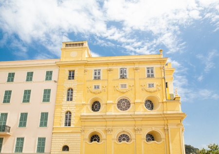Bright yellow buildings under nice blue sky in Nice, Franceの写真素材